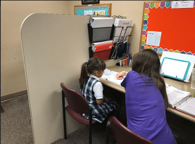 FPLA one-on-one decoding, reading comprehension tutoring session is underway. FPLA has helped students improve their reading proficiency by 2 grade levels in 90 days.